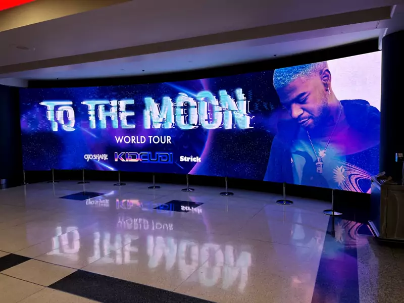 Large LED video wall on a stage, reflected in the floor