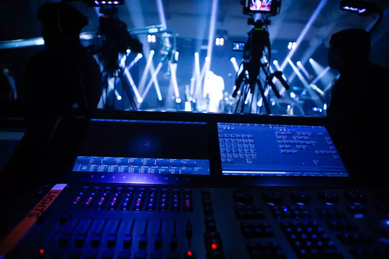 Moving-light beams over a band on stage