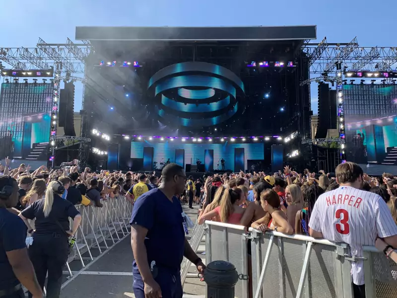 An SR Audio outdoor festival stage with a large crowd