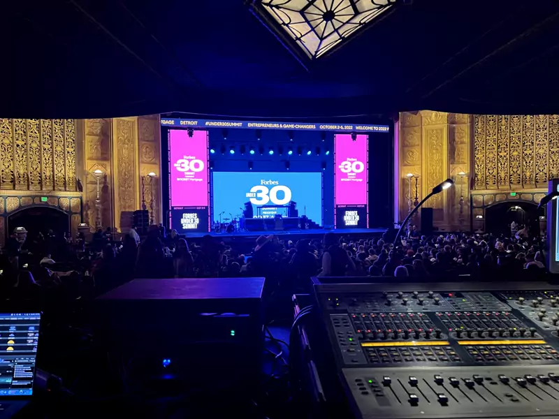 Digital mixing console at front of house during a show